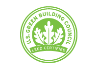 A round logo with three leaves in the center over a banner saying LEED Certified
