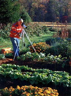 Walter Chandoha taking photographs in his garden.