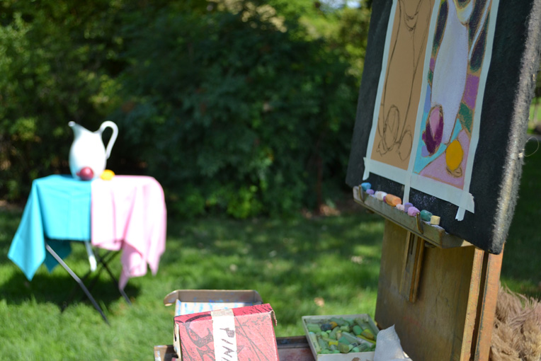  Still life with pastel painting in foreground 